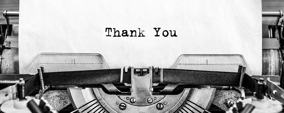 The words thank you written on a typewriter