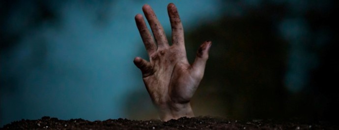 Zombie hand rising from grave. Dead-end backlinks have no business roaming your website